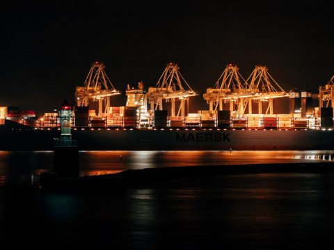cargo ship on dock during night time